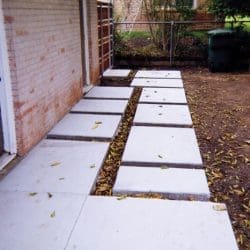 Concrete walkway and side entrance